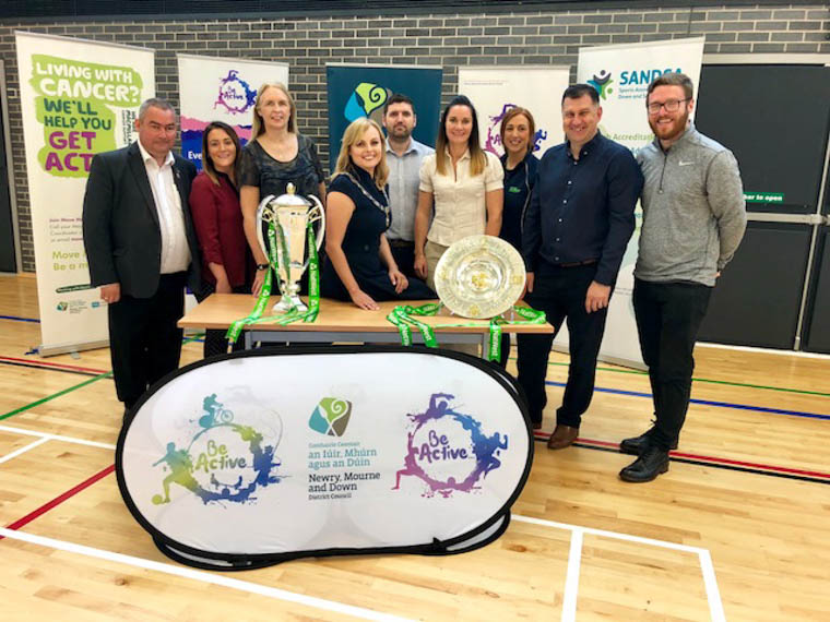 Deputy Chairperson Councillor Oksana McMahon (centre), Councillor Terry Andrews (far left) and Councillor Gareth Sharvin (far right), alongside staff from the Leisure and Sport section of Newry, Mourne and Down District Council. Deputy Chairperson Councillor Oksana McMahon (centre), Councillor Terry Andrews (far left) and Councillor Gareth Sharvin (far right), alongside staff from the Leisure and Sport section of Newry, Mourne and Down District Council.