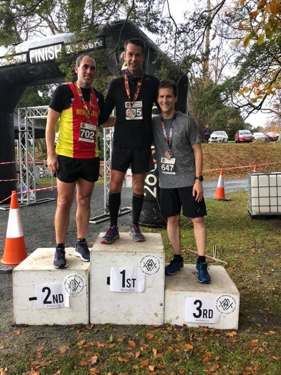 Johnny Gregg taking Podium 1st Place at the 26 Extreme Tollymore 10k Trail Race 