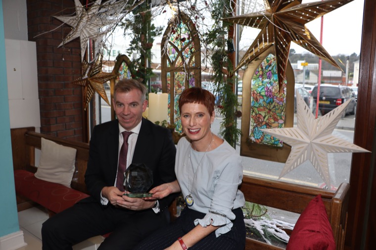 Joanna McCartney Hairdressing being awarded their Trophy from Newry BID manager, Eamonn Connolly.