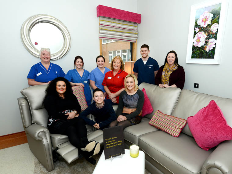 Pictured in the completed Family room are front from left: Belinda, Leo (Belinda&rsquo;s Son) and Claudine. Back Row; Karen Tirney Staff Nurse, Julie Elliott Staff Nurse, Dr Emma McGregor, Ruth McParland Ward Manager, Dr Daniel McKeever, Helena Murray Head of Service. 