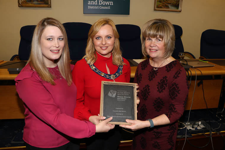 Councillor McMahon presents Kirsty Smyth Support Development Worker S.E. Trust and Janet Davidson Support Development Worker Southern Trust with a plaque. Councillor McMahon presents Kirsty Smyth Support Development Worker S.E. Trust and Janet Davidson Support Development Worker Southern Trust with a plaque.