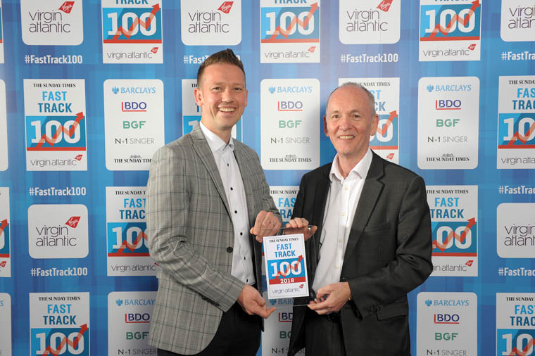 Gareth Chambers, CEO of Around Noon, and Howard Farquhar, Chairman of Around Noon with their Fast Track Award. Gareth Chambers, CEO of Around Noon, and Howard Farquhar, Chairman of Around Noon with their Fast Track Award.