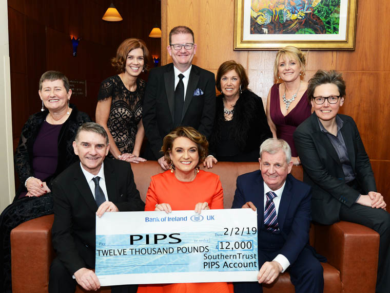 Southern Trust presents £12,000 to Charity Partners - PIPS Hope and Support and PIPS Upper Bann. (Back row L-R): Hilary McCartan, Non-Executive Director; Vivienne Toal, Director of Human Resources and Organisation Development; Chief Executive Shane Devlin; Non-Executive Director Geraldine Donaghy; Aldrina Magwood, Director of Performance and Reform and Eileen Mullan, Non Executive Director. Seated are Seamus McCabe, Chief Executive, PIPS Hope & Support; Roberta Brownlee, Trust Chair and Malachy Toman, Chairman PIPS Upper Bann. Southern Trust presents £12,000 to Charity Partners - PIPS Hope and Support and PIPS Upper Bann. (Back row L-R): Hilary McCartan, Non-Executive Director; Vivienne Toal, Director of Human Resources and Organisation Development; Chief Executive Shane Devlin; Non-Executive Director Geraldine Donaghy; Aldrina Magwood, Director of Performance and Reform and Eileen Mullan, Non Executive Director. Seated are Seamus McCabe, Chief Executive, PIPS Hope & Support; Roberta Brownlee, Trust Chair and Malachy Toman, Chairman PIPS Upper Bann.