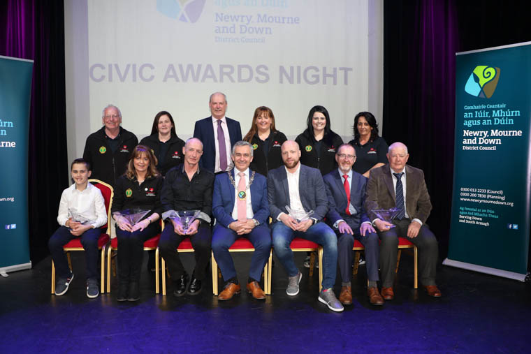 Chairman Newry, Mourne and Down District Council, Councillor Mark Murnin, CEO Liam Hannaway and Civic Award Recipients from Slieve Gullion Area, Conor Bannon, Colm (Bootsy) Fearon, John O’Hare, Bernard Boyle and Raymond McCumiskey Forkhill & District Development Association and six representatives from Crossmaglen First Responders. Chairman Newry, Mourne and Down District Council, Councillor Mark Murnin, CEO Liam Hannaway and Civic Award Recipients from Slieve Gullion Area, Conor Bannon, Colm (Bootsy) Fearon, John O’Hare, Bernard Boyle and Raymond McCumiskey Forkhill & District Development Association and six representatives from Crossmaglen First Responders.