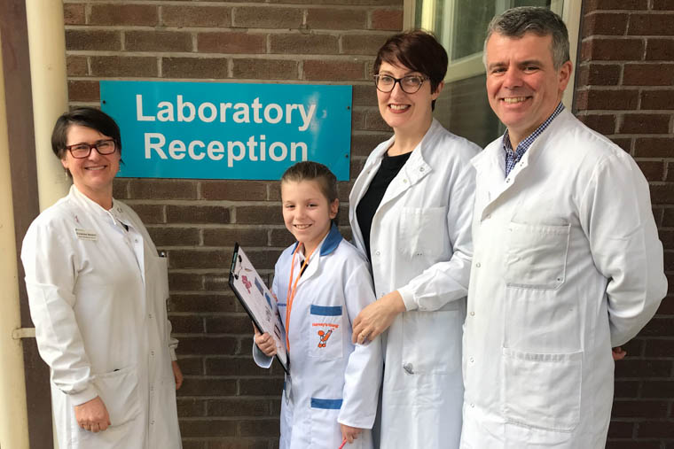 Vivienne Nesbitt, Lead Biomedical Scientist welcomes Sally McCloney and her parents Breige and Paul to the Laboratory at Craigavon Area Hospital. Vivienne Nesbitt, Lead Biomedical Scientist welcomes Sally McCloney and her parents Breige and Paul to the Laboratory at Craigavon Area Hospital.