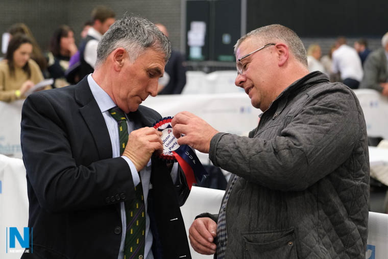 Ewan Morgan helps elected representative Harold McKee with his rosette. Photograph: Columba O'Hare/ Newry.ie Ewan Morgan helps elected representative Harold McKee with his rosette. Photograph: Columba O'Hare/ Newry.ie