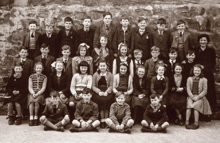 Pupils and teacher at Newry Model School, 1951. The school opened in 1849 as a District Model National School and was the first of its type in Ulster There were separate spaces for the “infants”, boys and girls and some students boarded. Courtesy of William McAlpine Pupils and teacher at Newry Model School, 1951. The school opened in 1849 as a District Model National School and was the first of its type in Ulster There were separate spaces for the “infants”, boys and girls and some students boarded. Courtesy of William McAlpine
