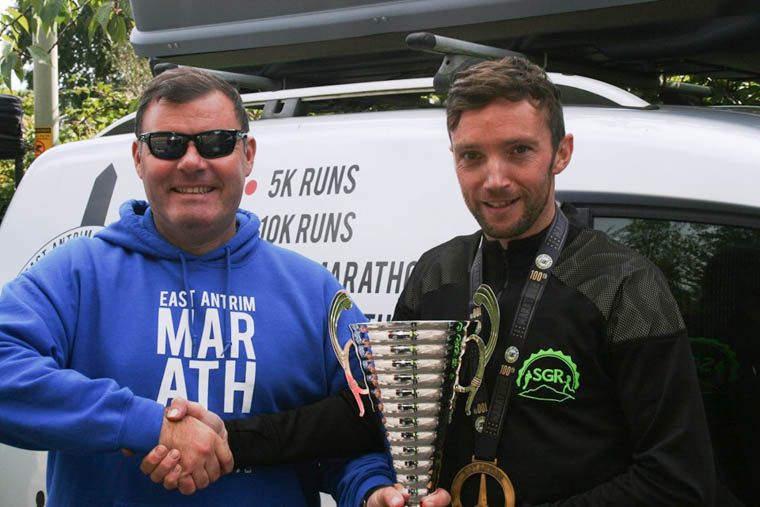 Barry receiving his Centurion Cup from Peter Montgomery at East Antrim Marathon Series Barry receiving his Centurion Cup from Peter Montgomery at East Antrim Marathon Series