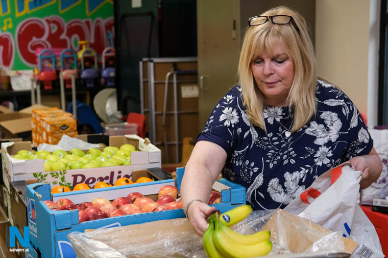 Helena Young, Meadow and Armagh Road Community Association packs fruit into bags. Photograph: Columba O'Hare/ Newry.ie Helena Young, Meadow and Armagh Road Community Association packs fruit into bags. Photograph: Columba O'Hare/ Newry.ie