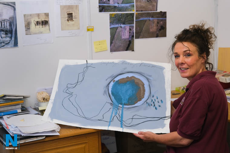 Anna Marie with her painting 'Bailey, Dougherty and Robinson - The three men that drew the Irish Border'. Photograph: Columba O'Hare/ Newry.ie 