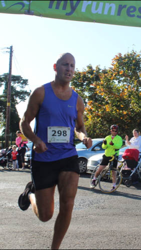 Lee Maginnis come over the finish line at the Annaghmore 5k Lee Maginnis come over the finish line at the Annaghmore 5k