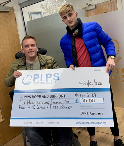Jake Gorman presents PIPS Hope and Support’s Fundraising Coordinator Padraig Harte with the proceeds of the charity football match.