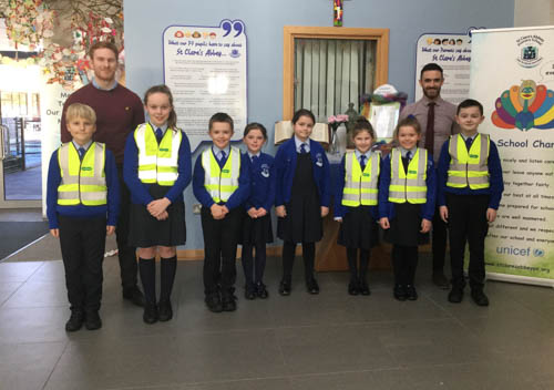 St Clare's Abbey PS Pictured: (Centre) Hollie Gibney P5 and Lily O’Hanlon P6, (far left) Mr Digney P5 teacher, (far right) Mr Hillen P6 teacher.