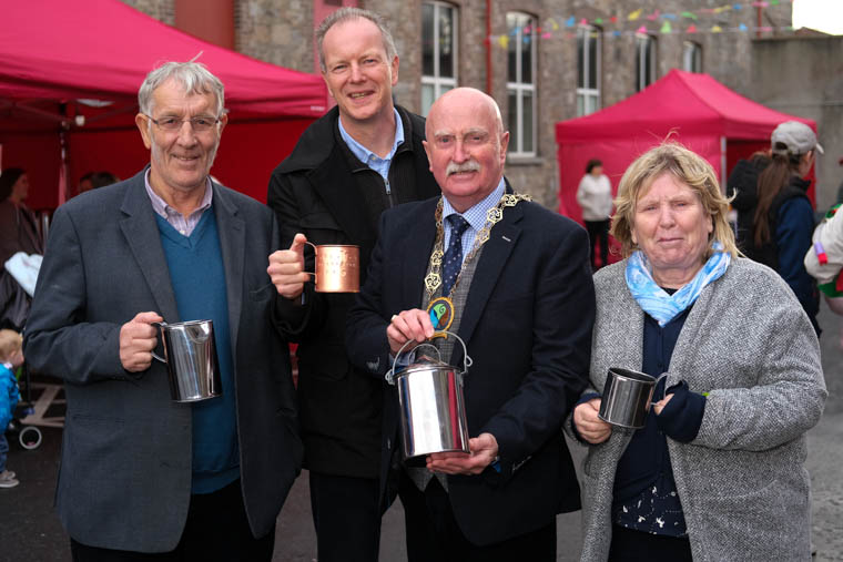 Councillor Charlie Casey, Chairperson, Newry, Mourne and Down District Council and Raymond Jackson, Chief Executive, Confederation of Community Groups with Travelling Tinsmith, Tom McDonnell and wife Margaret at the Patricia Graham ‘Shining Light 'Celebrating Volunteers Fayre 2019 at Ballybot House. Photograph: Columba O'Hare/ Newry.ie