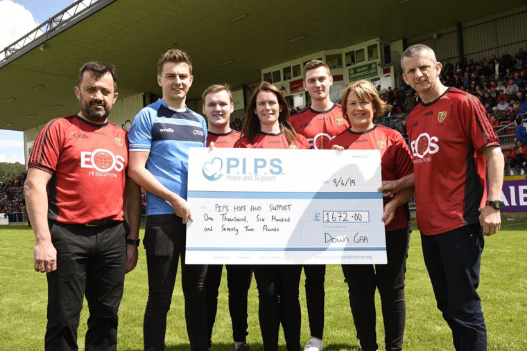 Paddy Mageean, second from left, is presented with a cheque for £1672.00 that was raised by Down GAA representatives in the 2019 Belfast Marathon. Representatives pictured (R-L) James Magennis, Maureen O’Higgins, Cailean Toner, Paula Magee, Oran Tumelty and Mark McCartney. Missing representatives from picture – Danielle de Rose, Niamh Morgan, Thomas O’Hare and Brian McAvoy Paddy Mageean, second from left, is presented with a cheque for £1672.00 that was raised by Down GAA representatives in the 2019 Belfast Marathon. Representatives pictured (R-L) James Magennis, Maureen O’Higgins, Cailean Toner, Paula Magee, Oran Tumelty and Mark McCartney. Missing representatives from picture – Danielle de Rose, Niamh Morgan, Thomas O’Hare and Brian McAvoy