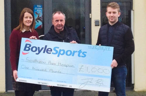 Joe O Donoghue Boylesports presents a cheque to Anne Mac Oscar Southern Area Hospice while Pat McGinn looks on. Joe O Donoghue Boylesports presents a cheque to Anne Mac Oscar Southern Area Hospice while Pat McGinn looks on.