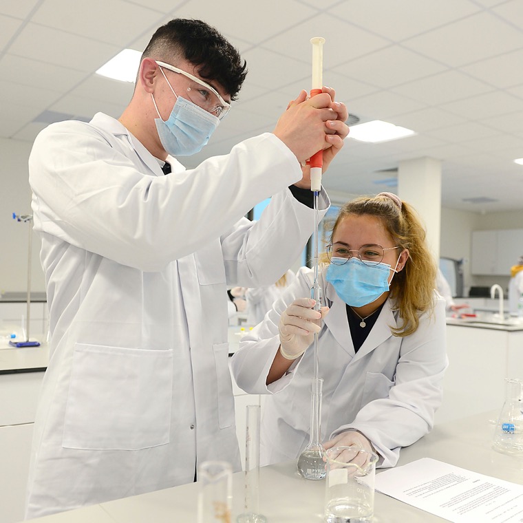 SRC students conducting an experiment in the laboratory.