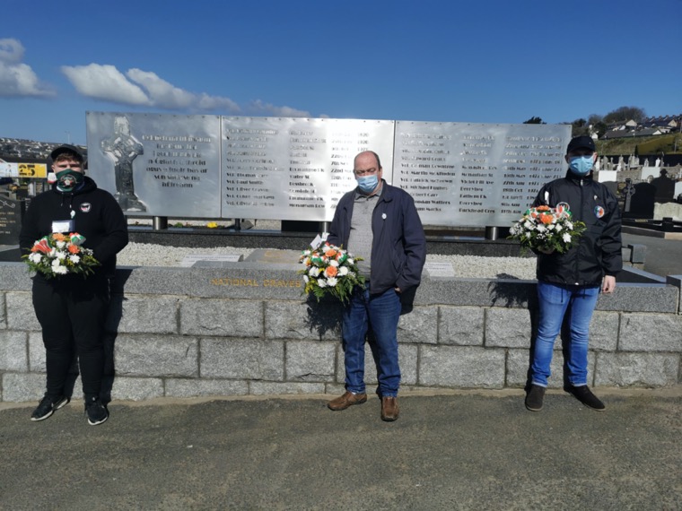 Saoradh members holding a wreath laying ceremony at St Mary's Cemetery in Newry.