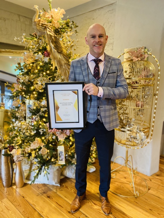 Jason Foody, General Manager of Killeavy Castle Estate with their award.