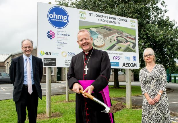 Archbishop Eamon Martin cuts the first sod for the new build at St Joseph's High School, Crossmaglen while School Principal Marie Millar and Education Minister Peter Weir look on. Archbishop Eamon Martin cuts the first sod for the new build at St Joseph's High School, Crossmaglen while School Principal Marie Millar and Education Minister Peter Weir look on.