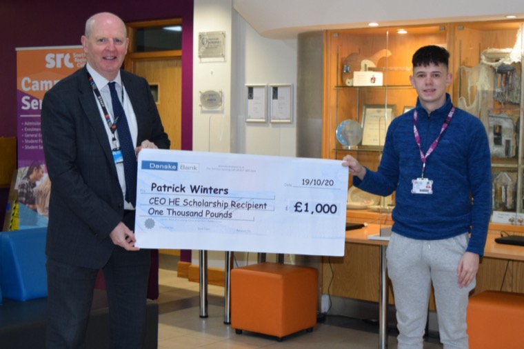 Patrick Winters, a Sport Science, Coaching and Fitness Foundation Degree student at Newry campus receiving his Scholarship from Mr Brian Doran, Chief Executive, SRC. Patrick Winters, a Sport Science, Coaching and Fitness Foundation Degree student at Newry campus receiving his Scholarship from Mr Brian Doran, Chief Executive, SRC.