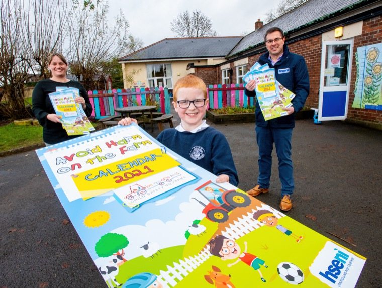 Pictured at the launch of the “Avoid Harm on the Farm” Child Safety 2021 Calendar is (L-R) Joanne Bryans, Principal, Carr PS, Daniel Glenn, Carr PS, and Robert Kidd, Chief Executive HSENI.