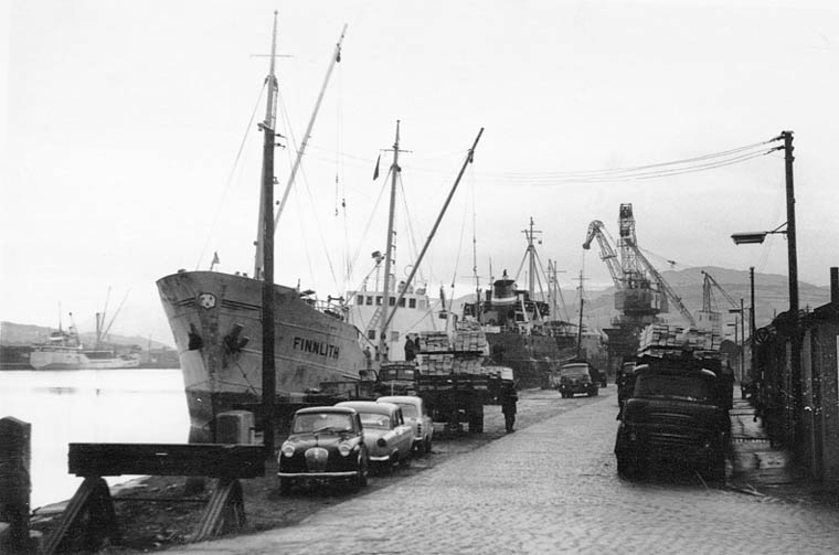 The Port of Newry in the 1960s. Timber is pictured here being unloaded from a Scandinavian ship. The port was still busy at this time but the limitations of the Newry Ship Canal meant that larger ships could not come to Newry and the docks closed in 1974. Courtesy of John Matthews The Port of Newry in the 1960s. Timber is pictured here being unloaded from a Scandinavian ship. The port was still busy at this time but the limitations of the Newry Ship Canal meant that larger ships could not come to Newry and the docks closed in 1974. Courtesy of John Matthews