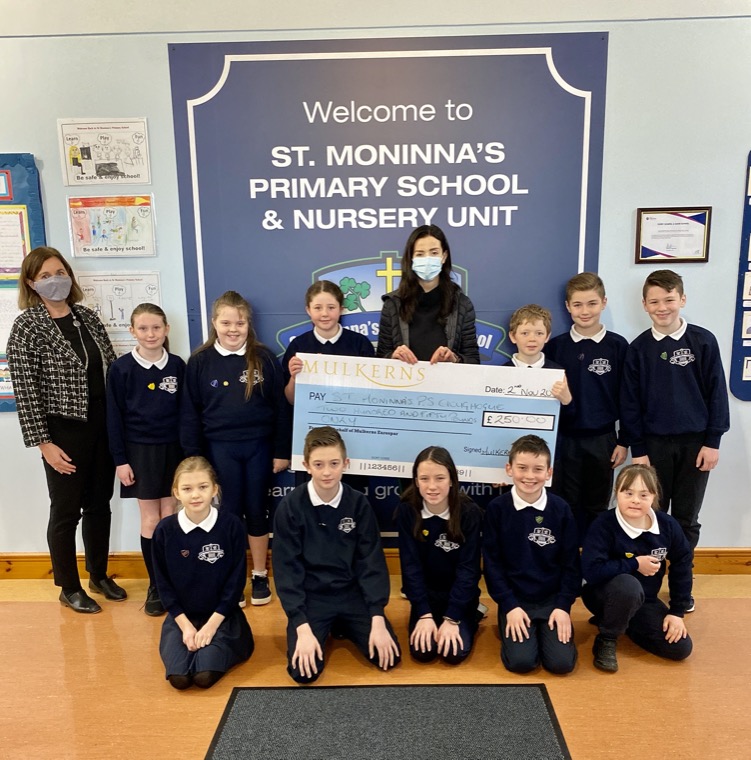 Kelly McKeown presents Runners Up Prize of £250 to Principal of St Moninna’s PS Cloughoge & some pupils from P7. Kelly McKeown presents Runners Up Prize of £250 to Principal of St Moninna’s PS Cloughoge & some pupils from P7.