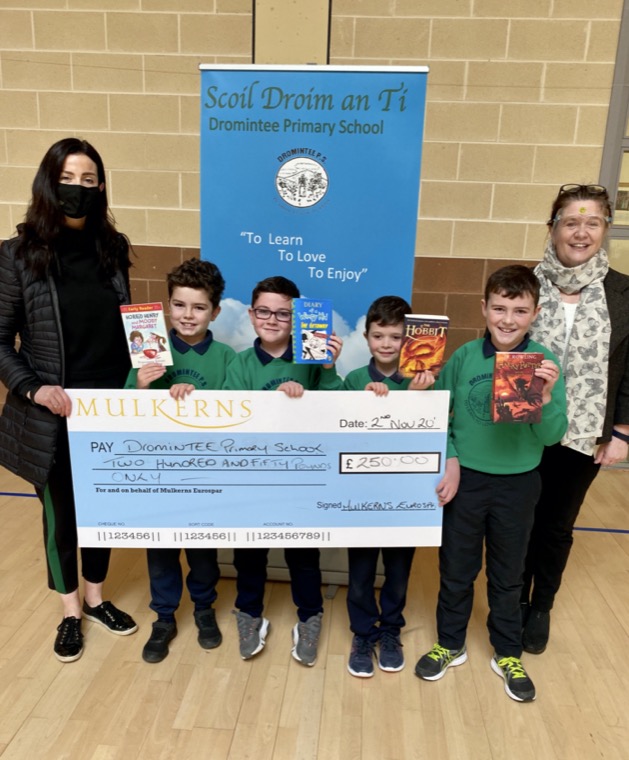 Kelly McKeown presents Runners Up prize of £250 to Wendy McKeown Principal of Dromintee PS and some of the P5s who are also proudly displaying some of the books purchased with the prize money. Kelly McKeown presents Runners Up prize of £250 to Wendy McKeown Principal of Dromintee PS and some of the P5s who are also proudly displaying some of the books purchased with the prize money.