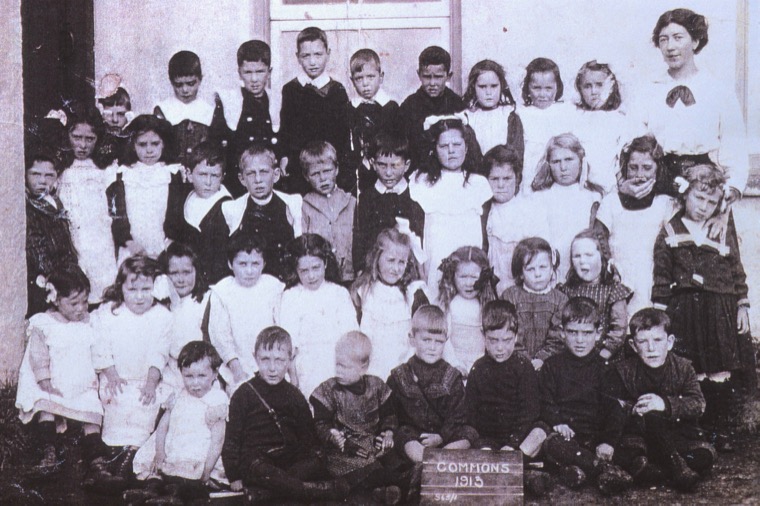 Pupils at Commons National School, 1913. The Commons school was a typical 19th century school building consisting of a one room classroom and an adjoining residence for the Master. Catholic children transferred from this school to the new Ballyholland Primary School in 1921 Courtesy of William McAlpine Pupils at Commons National School, 1913. The Commons school was a typical 19th century school building consisting of a one room classroom and an adjoining residence for the Master. Catholic children transferred from this school to the new Ballyholland Primary School in 1921 Courtesy of William McAlpine