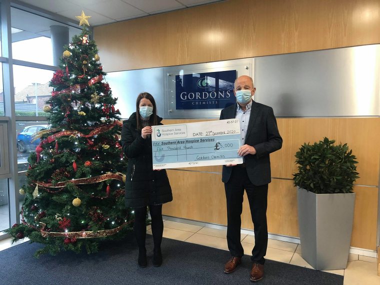 Robert Gordon, Managing Director of Gordons Chemists is pictured presenting a cheque for £5000 to Anne Mac Oscar, Corporate Partnerships Officer at Southern Area Hospice. Gordons Chemists made the generous donation towards the Southern Area Hospice Corporate Christmas Gift Appeal.