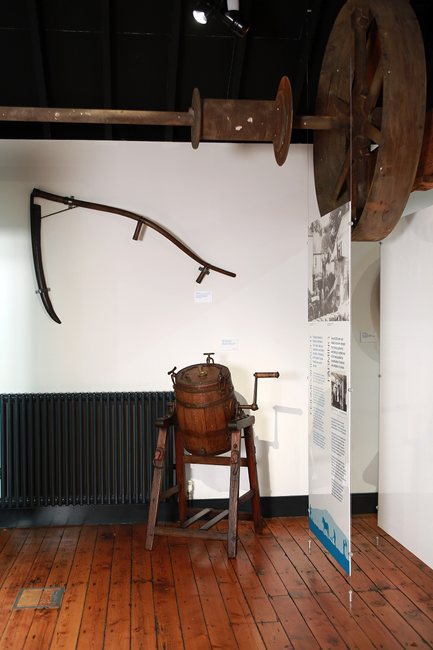 End-over-end churn and scythe on display in Newry and Mourne Museum. Both these artefacts came from a farm in Donaghmore, a few miles north of Newry in County Down. Newry and Mourne Museum Collection End-over-end churn and scythe on display in Newry and Mourne Museum. Both these artefacts came from a farm in Donaghmore, a few miles north of Newry in County Down. Newry and Mourne Museum Collection