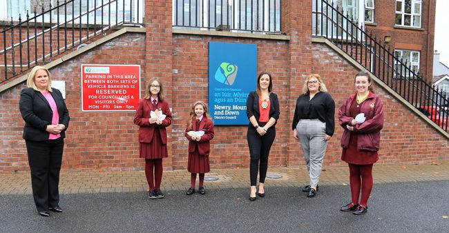 St Mary's High School Teacher Lisa Mulligan and pupils Amelia, Emilia and Caoimhe present their Climate Change Leaf Pledges at Council Offices to Marie Ward CEO and Council Chairperson, Councillor Cathy Mason Newry, Mourne and Down Council. St Mary's High School Teacher Lisa Mulligan and pupils Amelia, Emilia and Caoimhe present their Climate Change Leaf Pledges at Council Offices to Marie Ward CEO and Council Chairperson, Councillor Cathy Mason Newry, Mourne and Down Council.
