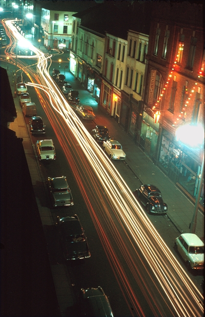 Hill Street in Newry pictured on Christmas Eve night in 1962. Foster’s department store can be seen on the right decorated with coloured lights. © William McAlpine Hill Street in Newry pictured on Christmas Eve night in 1962. Foster’s department store can be seen on the right decorated with coloured lights. © William McAlpine