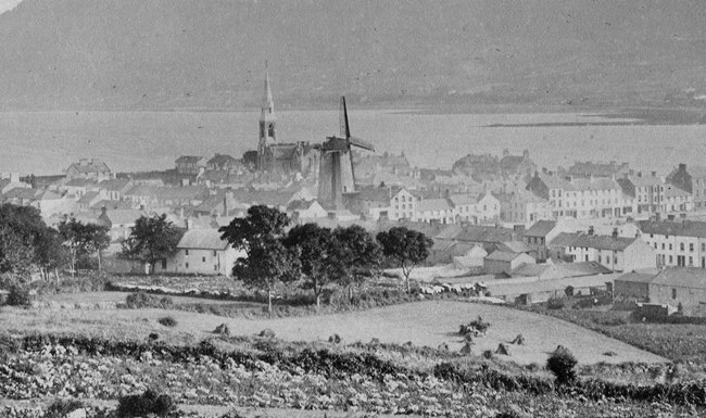 Warrenpoint pictured from the Bridle Lonan c.1900 showing the windmill dominating the town. Local framers bought their corn and wheat to the mill to be ground.  Newry and Mourne Museum Collection