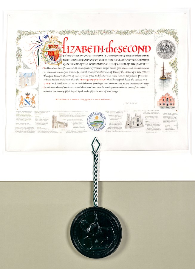 The charter, presented by Queen Elizabeth II, granting City Status to Newry in 2002, now on display in Newry and Mourne Museum. Newry and Mourne Museum Collection The charter, presented by Queen Elizabeth II, granting City Status to Newry in 2002, now on display in Newry and Mourne Museum. Newry and Mourne Museum Collection
