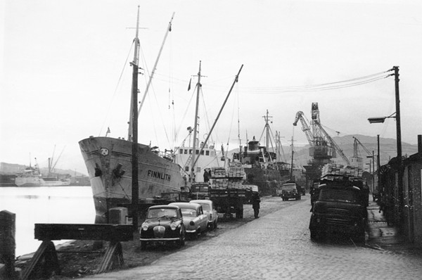 Ships from Scandinavia unloading timber in the Port of Newry c.1969. The site of the docks is now occupied by The Quays Shopping Centre. Newry and Mourne Museum Collection