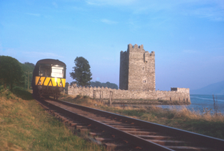 A train on the Newry to Warrenpoint railway line passing Narrow Water Castle in the summer of 1964. The line closed in January 1965. © William McAlpine A train on the Newry to Warrenpoint railway line passing Narrow Water Castle in the summer of 1964. The line closed in January 1965. © William McAlpine