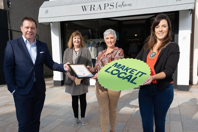 Newry, Mourne and Down District Council Chairperson, Councillor Cathy Mason with CEO of Retail NI, Glynn Roberts presenting Wraps Owner, Claire Braniff with the Retail NI Irish News High Street Hero Gold Award alongside Council Officer, Margaret Quinn. Newry, Mourne and Down District Council Chairperson, Councillor Cathy Mason with CEO of Retail NI, Glynn Roberts presenting Wraps Owner, Claire Braniff with the Retail NI Irish News High Street Hero Gold Award alongside Council Officer, Margaret Quinn.