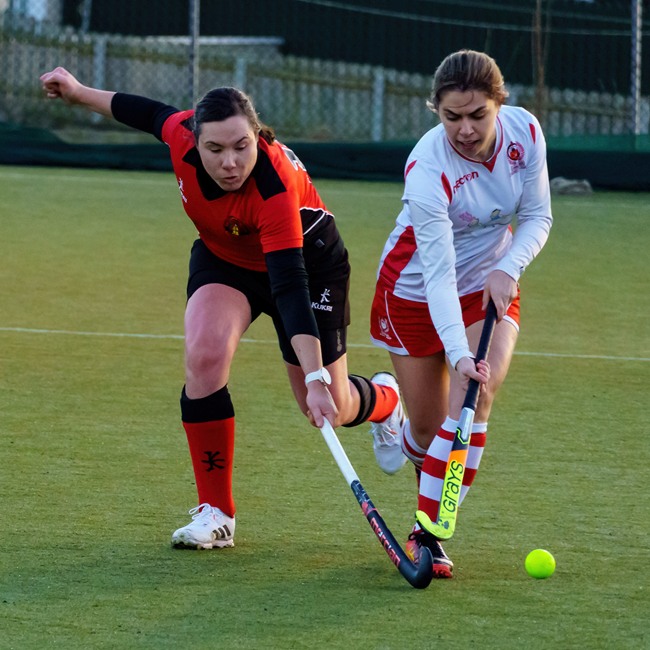 Kathryn Baird tackles her Larne opponent
