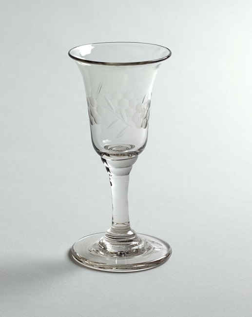 Drinking glass made in Newry decorated with grapes. Newry and Mourne Museum Collection