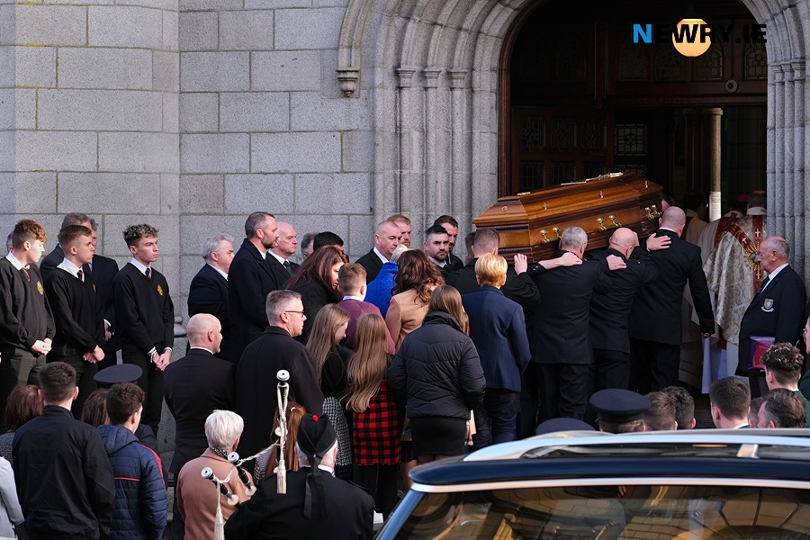 Deacon John McClelland's remains are taken in to Newry Cathedral for his Funeral Mass.