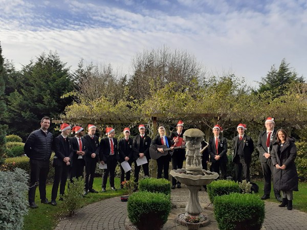 Students from St Patrick's College Armagh sing at the Hospice.