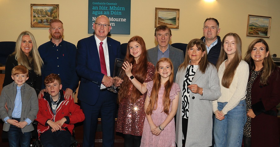Newry, Mourne and Down District Council Chairperson, Councillor Michael Savage pictured with Sophie Lennon and her parents Theresa and Marcus along with family members.