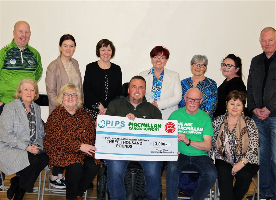 Three Ways Community Association members pictured presenting the proceeds to Macmillan Cancer, Newry Gateway and PIPS Hope and Support  (Back, L-R) Mo Rooney, Amy O’Gorman, Mary Markey, Lesa Rooney, Sheila Tumilty, Bernie Hollywood, Paddy O’Gorman.  (Front L-R) Patricia O’Gorman, Deidre Shields (Newry Gateway), Padraig Harte (PIPS Hope and Support), Aidan Carroll (Macmillan Cancer) and Cathy Keenan