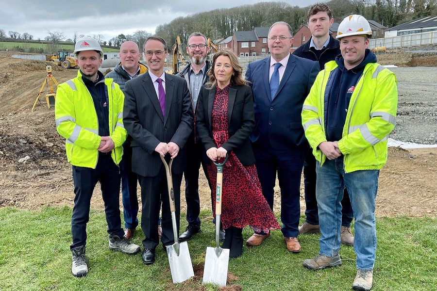 Education Permanent Secretary Dr Mark Browne, Principal Anne Anderson and contractors cutting the first sod to officially mark the beginning of construction works at New-Bridge Integrated College.