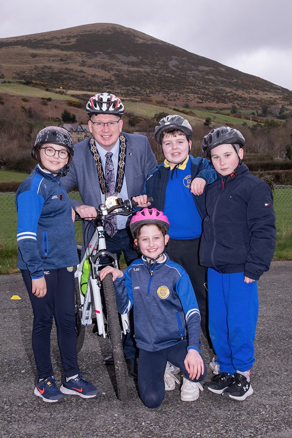 Newry, Mourne and Down District Council Chairperson, Councillor Michael Savage with some of the pupils who took part in a cycling proficiency session at Killowen PS. Included are pupils Lily Cousins, Tara Gibbons, Danny McConville and Kevin Stokes.