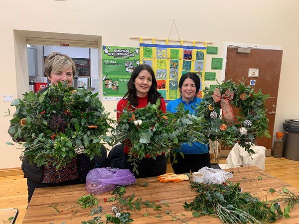 Marlene Rice, Lorraine Quinn and Tinnie Davidson make some Christmas Wreaths at Newtownhamilton Community Association.