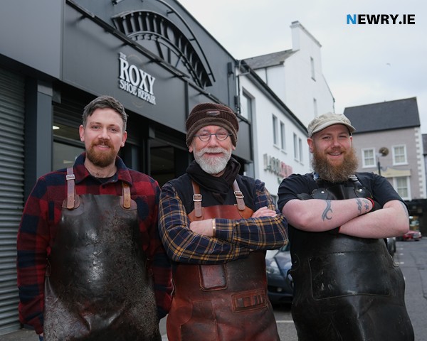 John Haughian and sons Ryan and Paul pictured outside the current Roxy Shoe Repair. Photograph: Columba O'Hare/ Newry.ie