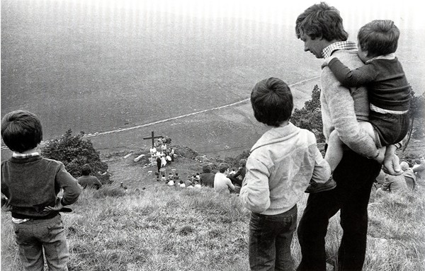 Mass being celebrated in the1980s at Altataggart mass rock, outside Hilltown, Co. Down. © Sean Hillen
